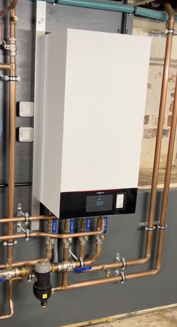 Viessmann wall mounted boiler with copper pipework, isolation valves and a system filter